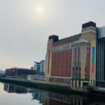The photo shows Baltic Centre for Contemporary Art with the river flowing beside it.