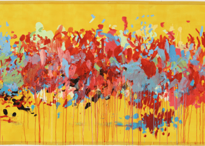 A large abstract painting with a bright yellow background. reds, blues, oranges and pinks are dotted, spattered, and shipped with long drips marks running off the page at the bottom.