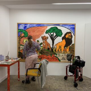 Helen in the studio working on a large painting.