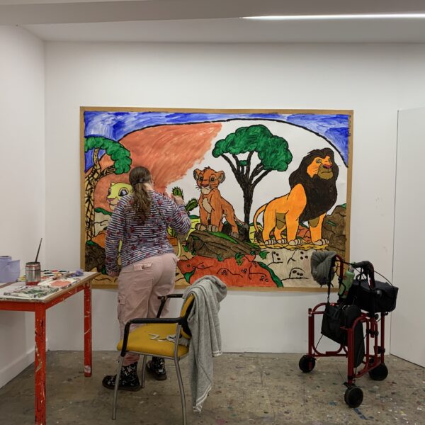 Helen in the studio working on a large painting.